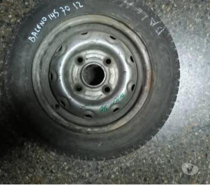 Accesorios para Autos Santiago Santiago - Fotos de 1 llanta aro 12 con neumàtico Suzuki baleno o similares.