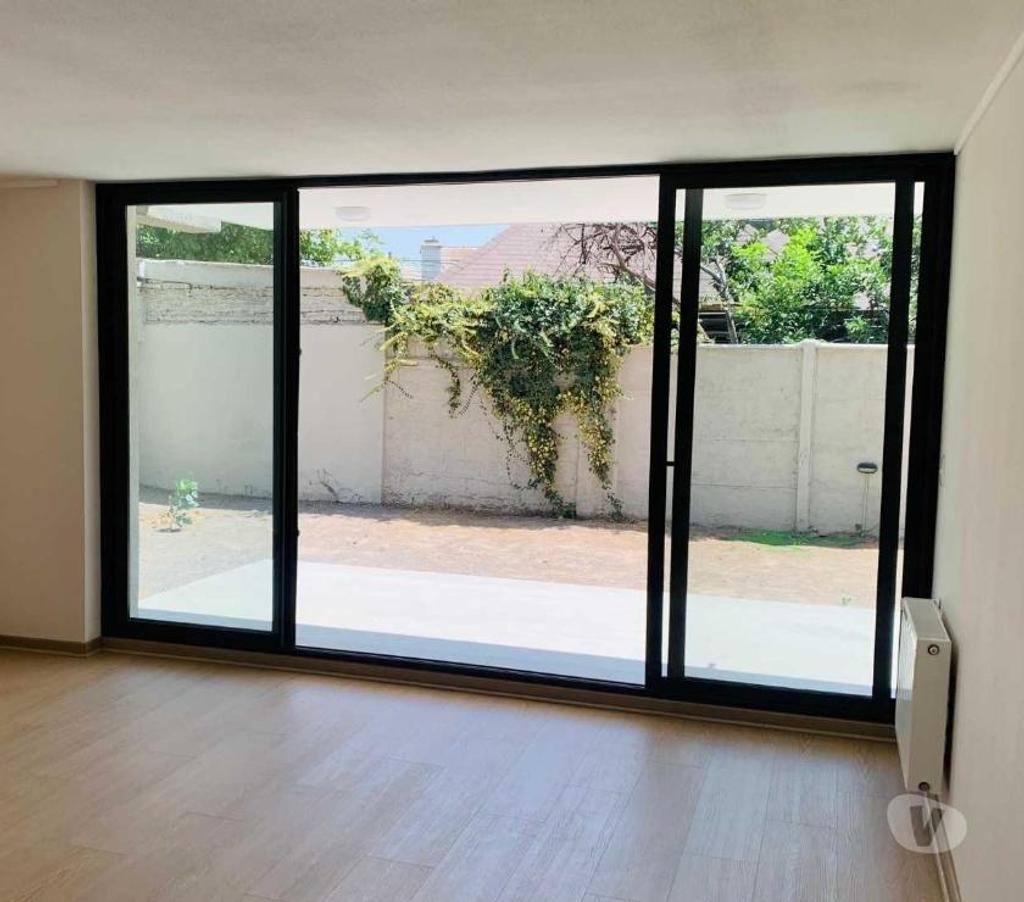 Bienes Raices Santiago La Reina - Fotos de Depto. nuevo con 180 m2 de patio exclusivo y 100 m2 útil