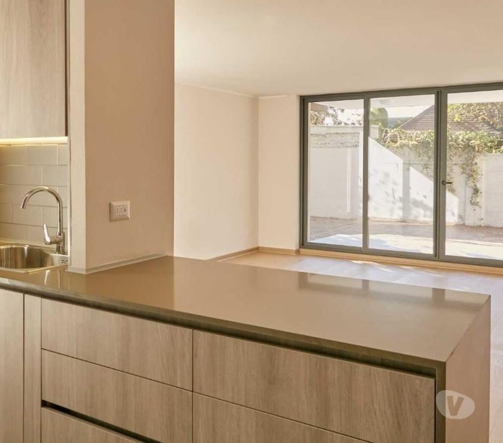 Bienes Raices Santiago La Reina - Fotos de Depto. nuevo con 180 m2 de patio exclusivo y 100 m2 útil