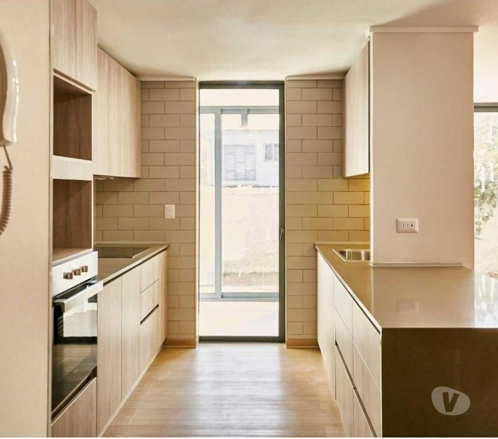 Bienes Raices Santiago La Reina - Fotos de Depto. nuevo con 180 m2 de patio exclusivo y 100 m2 útil