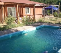 ARRIENDO PARCELA CON CASA Y CABAÑAS